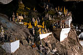 Luang Prabang, Laos - The Pak Ou Caves, the lower cave called Tham Ting. The caves, a Buddhist pilgrimage site, are a repository of old Buddha statues. 